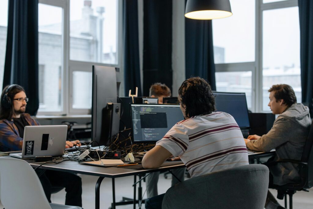 web development team working on code in modern office